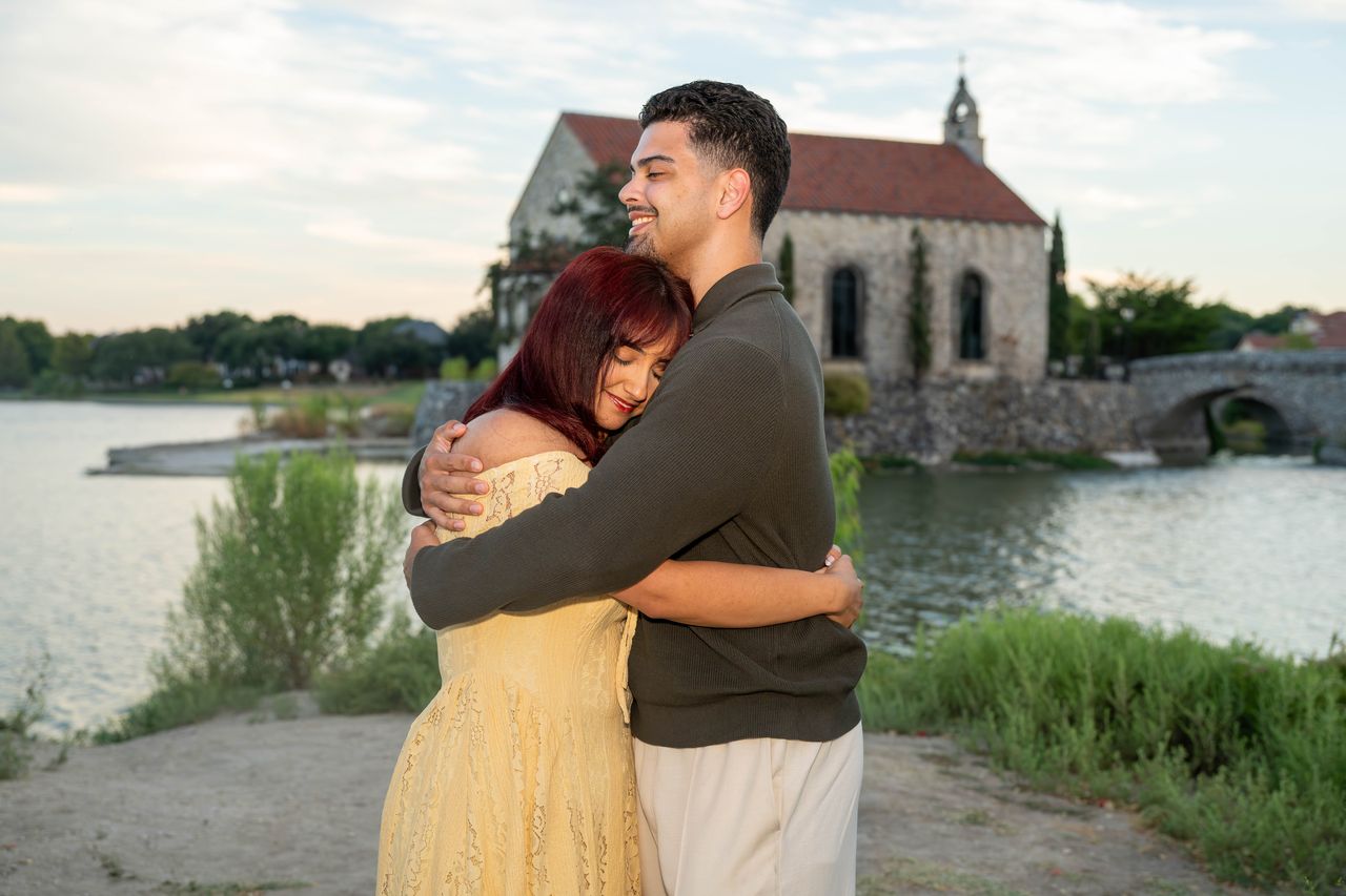 Ana hugs Luca in front of the chapel, eyes closed