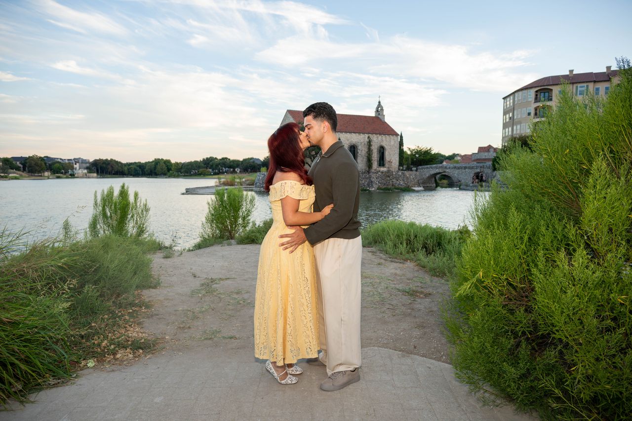 Luca and Ana kiss on the path by the lake